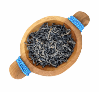 Kenyan Purple Tea Loose Leaf presented in a wooden bowl
